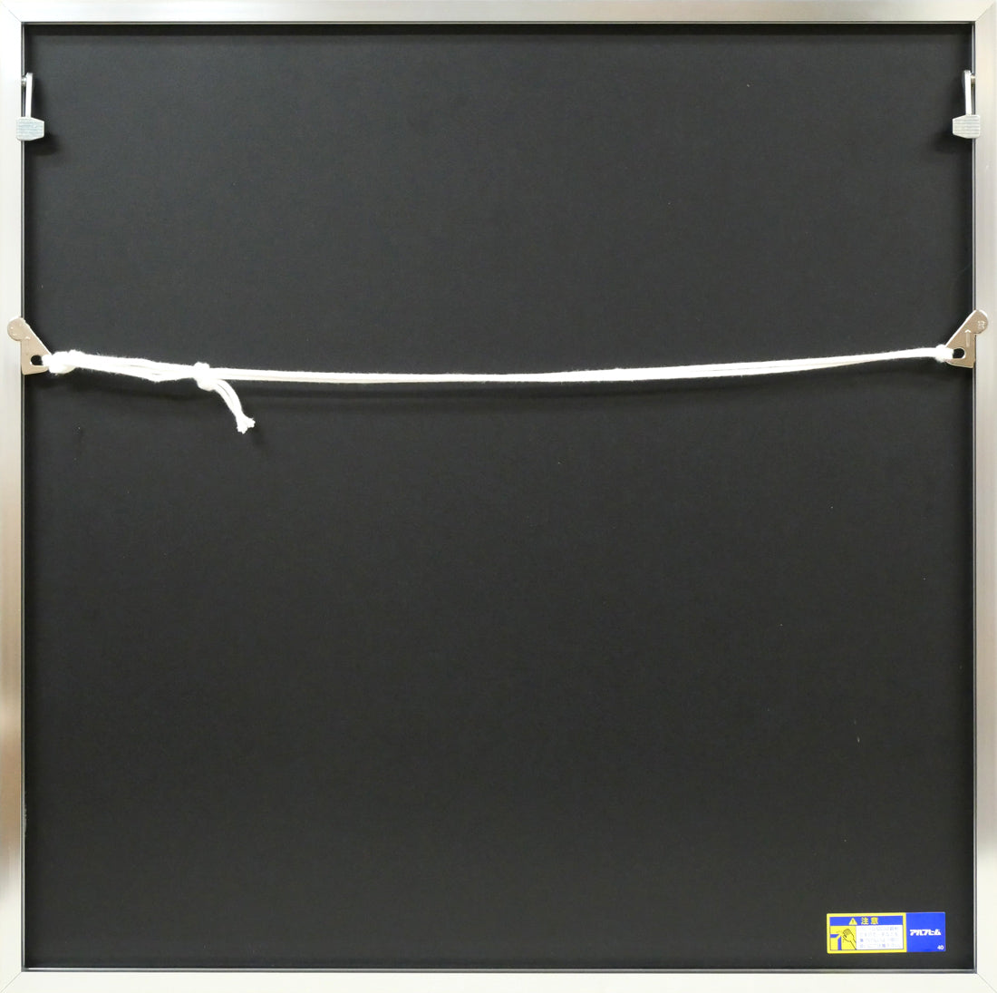 岡部昌生「無題(赤)」紙にフロッタージュ 額縁裏側画像